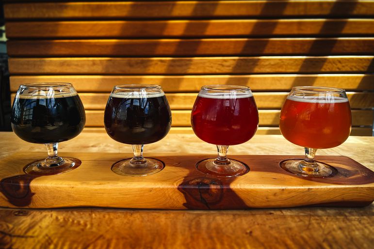 A Beer flight arranged from dark to light beer.