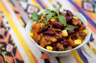 Chili con carne. Traditional mexican spicy beef dish. Minced beef cooked with red kidney beans, sweetcorns and red really hot chillies.