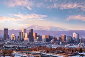 A view of Denver with mountains in the background