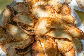 Empanadas on a plate in sunlight. 