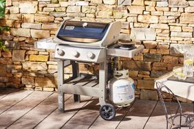 Weber Spirit II E-310 3-Burner Gas Grill displayed on pavers