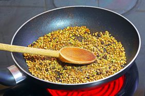 Spices are toasted on the stovetop in a nonstick fry pan