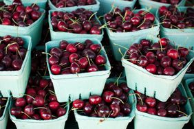 Baskets of fresh cherries at the farmer's market.