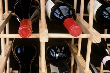 Wine bottles on a wine rack. 