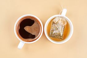 Cup of coffee and a cup of tea from above.