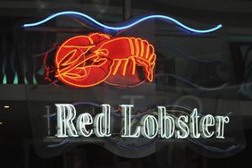 A neon sign is illuminated inside a Red Lobster restaurant in Times Square, New York, U.S.