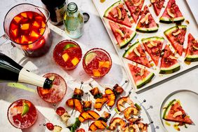 A summer party spread of appetizers and sparkling drinks