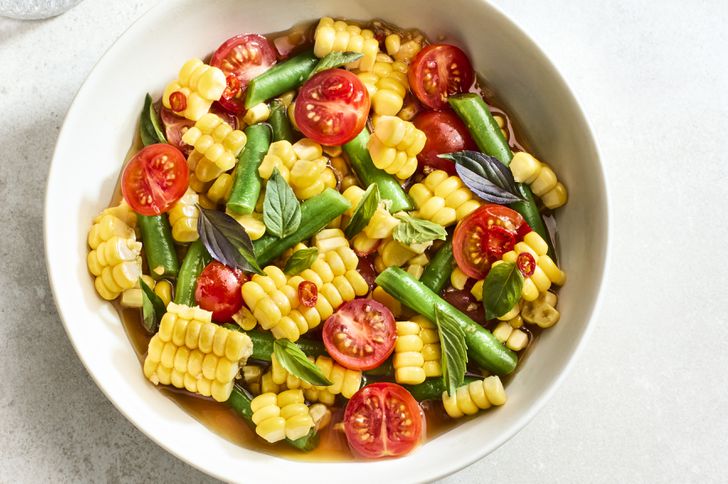 Thai-Inspired Corn Salad in a white bowl