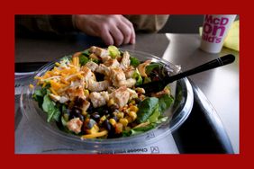 Mequon, WI / USA: A McDonald's Southwest Chicken Salad sits on a table with a soda.