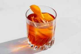 Treacle No.1 Cocktail in rocks glass over ice with an orange twist.